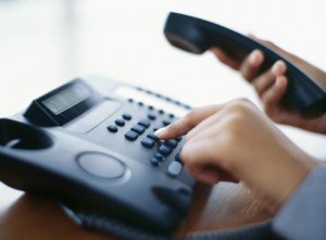 Man pressing button on phone system