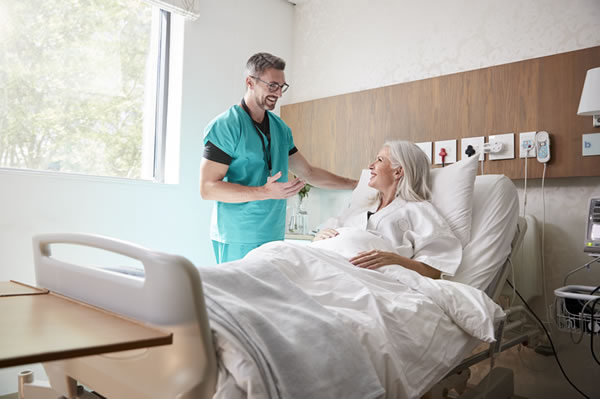 Nurse talking to hospital patient